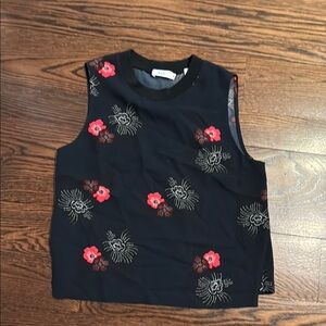 Black Sleeveless Top with Red Floral Design